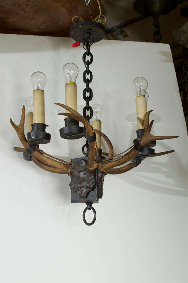 Hard to find an original antique chandelier with real antlers.  Mostly you will only see very modern and recent chandeliers of this type.  This is the first one we have encountered.  This would look great in your cabin or your country room.  All the