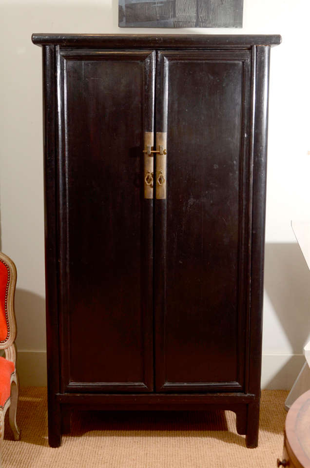 A Pair of Black Lacquered Sloping-Stile Wood-Pin Hinged Cabinets