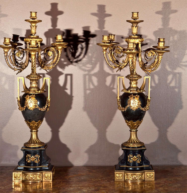 Magnificent pair of French 19th Century Louis XVI style six light candelabra in urn form. Having the highest quality dore bronze and marble.