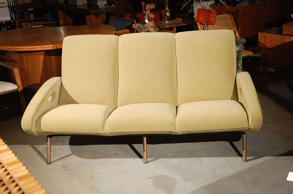 sofa upholstered in green mohair w/brass legs