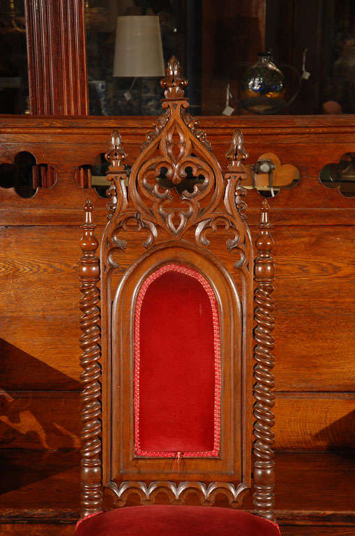 Pair walnut carved side chairs with red velvet upholstery, and quatrefoil tracery carving