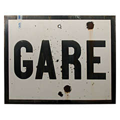 Metal sign "GARE" which means "train" in French