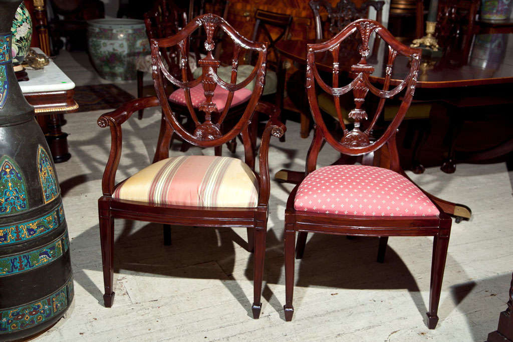 2 ARM CHAIRS AND  6 SIDE CHAIRS COMPRISE THIS SET OF SHIELD SHAPE  BACK  DINING CHAIRS. SLIP SEATS