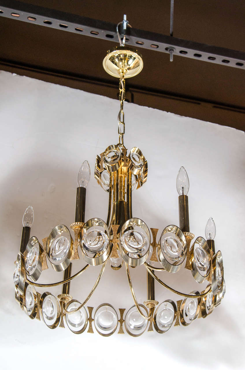 This elegant chandelier by Palwa is made of gilded and textured brass with beveled crystal adornments. It has six candelabra bulbs (Max 360 Watts) and has been completely rewired and the height can be adjusted to suit.