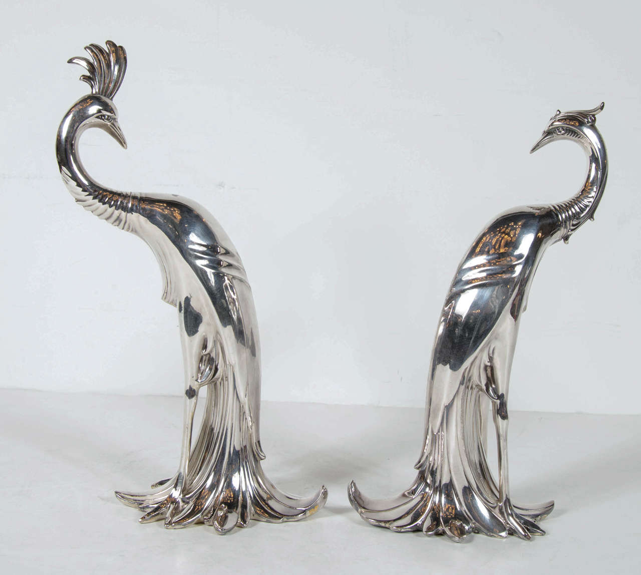 This stunning pair of Art Deco features a male peacock with its grand plumage and its head feathers it also has the companion female peacock as well. These are made by the W. B manufacturing company that made exquisite trophies in the 1920s and