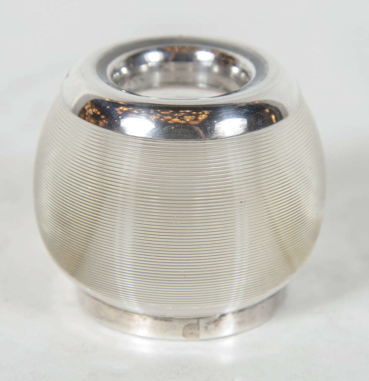 The ribbed glass inkwell features a sterling base and rim and is marked sterling