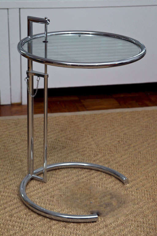 STAINLESS STEEL AND GLASS SIDE TABLES-  HEIGHT IS ADJUSTABLE. EDITION FROM 1980'S