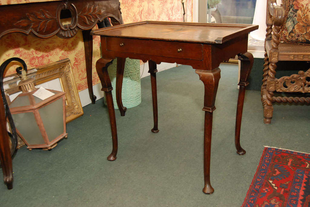 A English Table with a inlaid star, and banding in Tiger Oak, all original, great patena, Great condition.