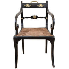 An English Regency Ebonized Armchair