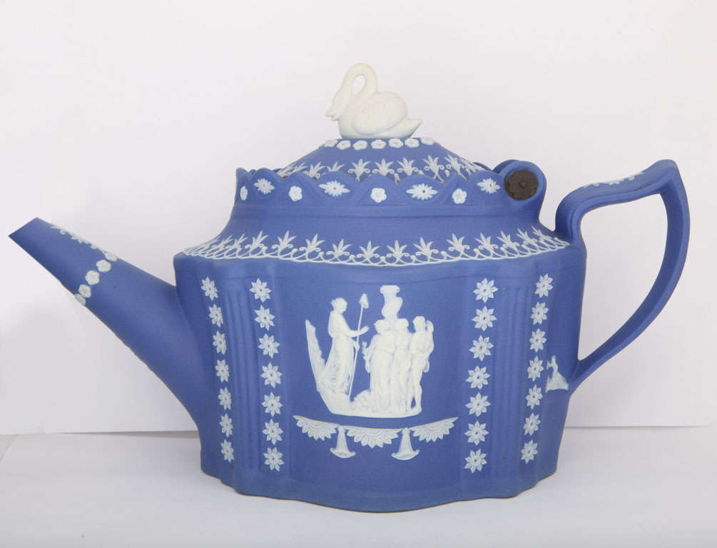 A rare unmarked Adams blue and white jasper teapot with classical figure and swan finial