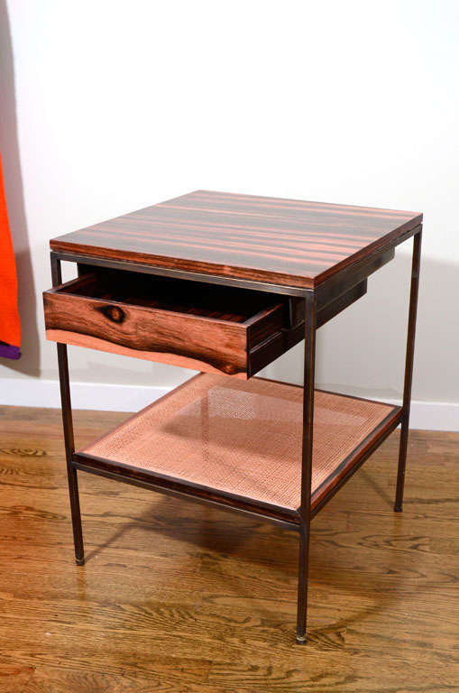 American Pair of ebony, cane and oiled bronze bedside tables