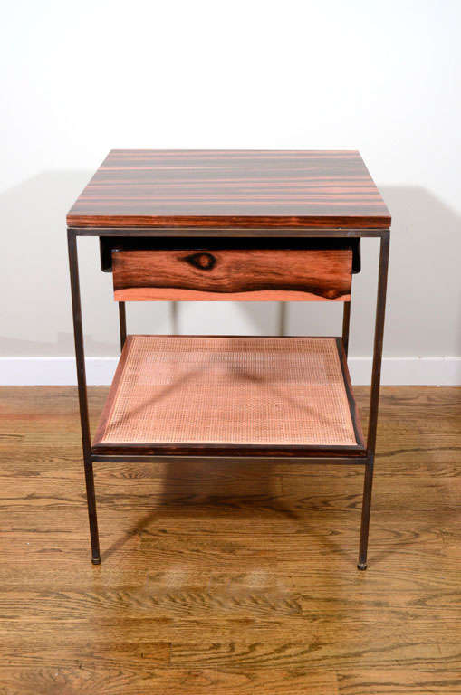 Mid-Century inspired bedside tables from reGeneration's new line.  Macassar ebony and cane on oiled bronze frames.  