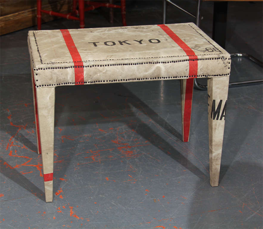 custom bench reupholstered in  heavy canvas Japanese mail bag.   very sturdy, perfect as side table, bench, or extra seating at dining table