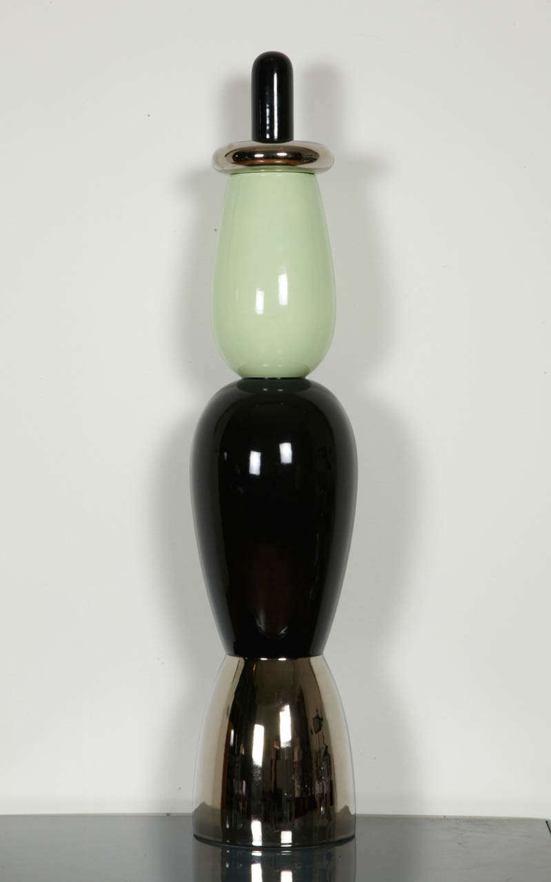 Stilobate column from the Column Collection created in 2008 by Alessandro Mendini (born in 1931). Superego Edition limited to 50 numbered copies. The column is surmounted by a box with a lid. Black, green and chrome enameled porcelain. Signed under