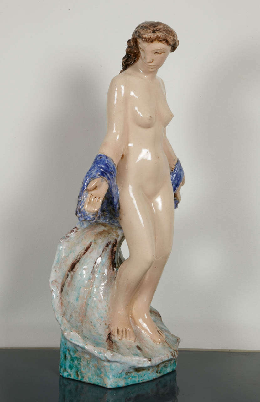 Large beige, blue and green with nuance of brown enameled ceramic sculpture representing a naked Venus by Edouard Cazaux (1889-1974). Signed Cazaux on the base back.