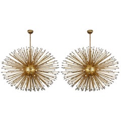Pair of oval brass chandeliers