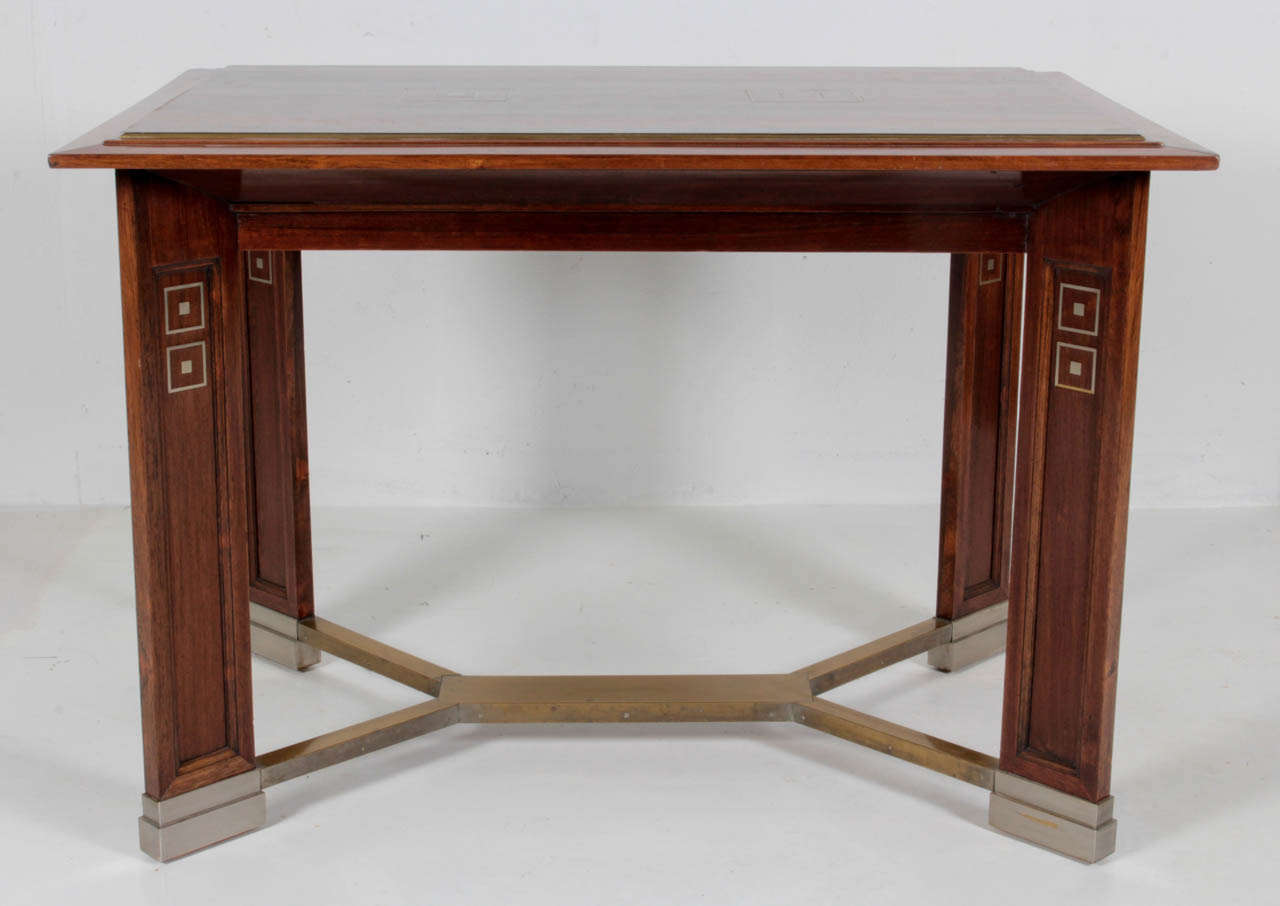 KOLOMAN MOSER  attr.  (1868-1918)  Austria
PORTOIS & FIX  Vienna, Austria 

Secessionist center table  c. 1902

Exotic wood with brass inlaid squares, brass stretcher and feet with nickel-plated sabots

Marks: No. 29378 (inventory paper