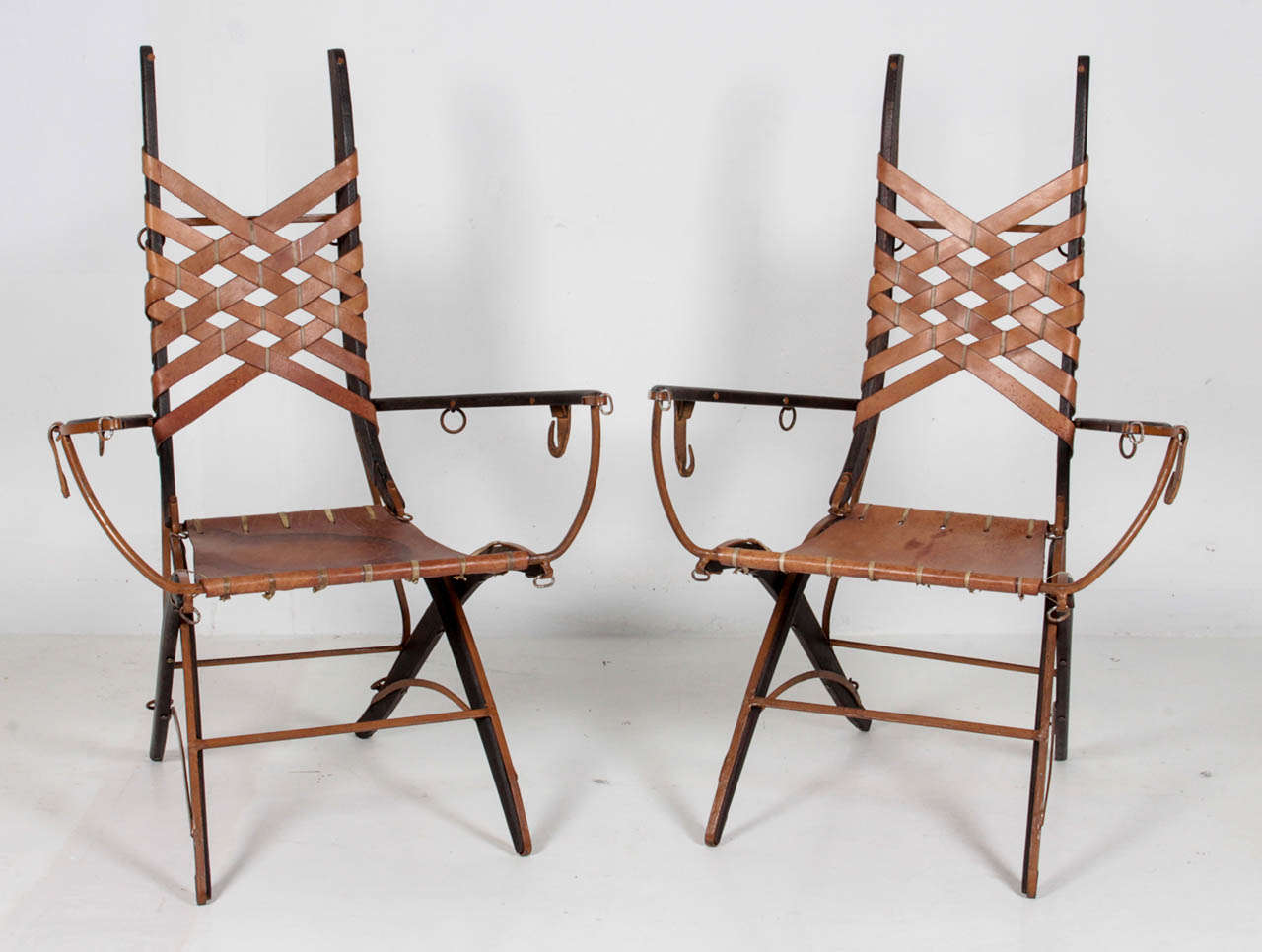 ALBERTO MARCONETTI  Milan, Italy (active Argentina)

Armchairs (Two available) c. 1960's

Oak, painted iron, leather strapwork and seat

Marks:  by Alberto Marconetti  (script signature)

H: 40 1/2”  x  W:  27”  x D: 21”
Seat height: 19