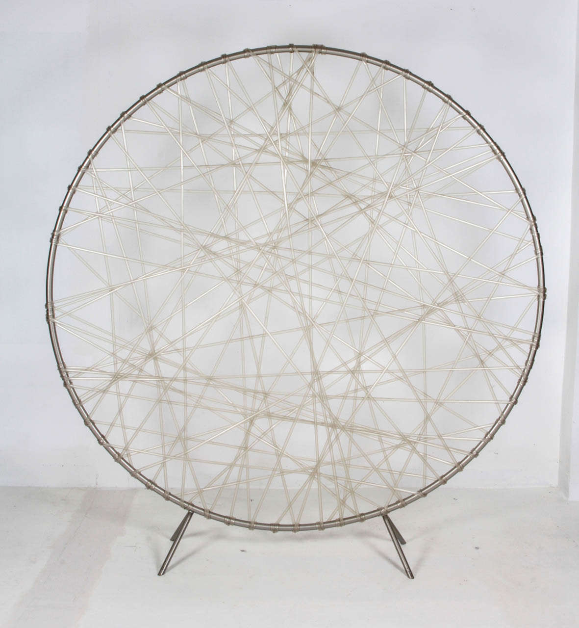 Humberto Campana (1953 - )  Brazil
Fernando Campana (1961 - ) Brazil

Zig Zag Screen, 2001

Circular iron frame with electrostatic silver painted surface, translucent PVC hose stretched in a web pattern.

Illustrated: Campanas, Humberto and