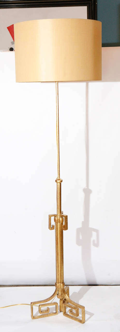 A fabulous vintage French Greek key motif floor lamp. Lamp is gilded in 22k gold leaf. Lamp height is 72