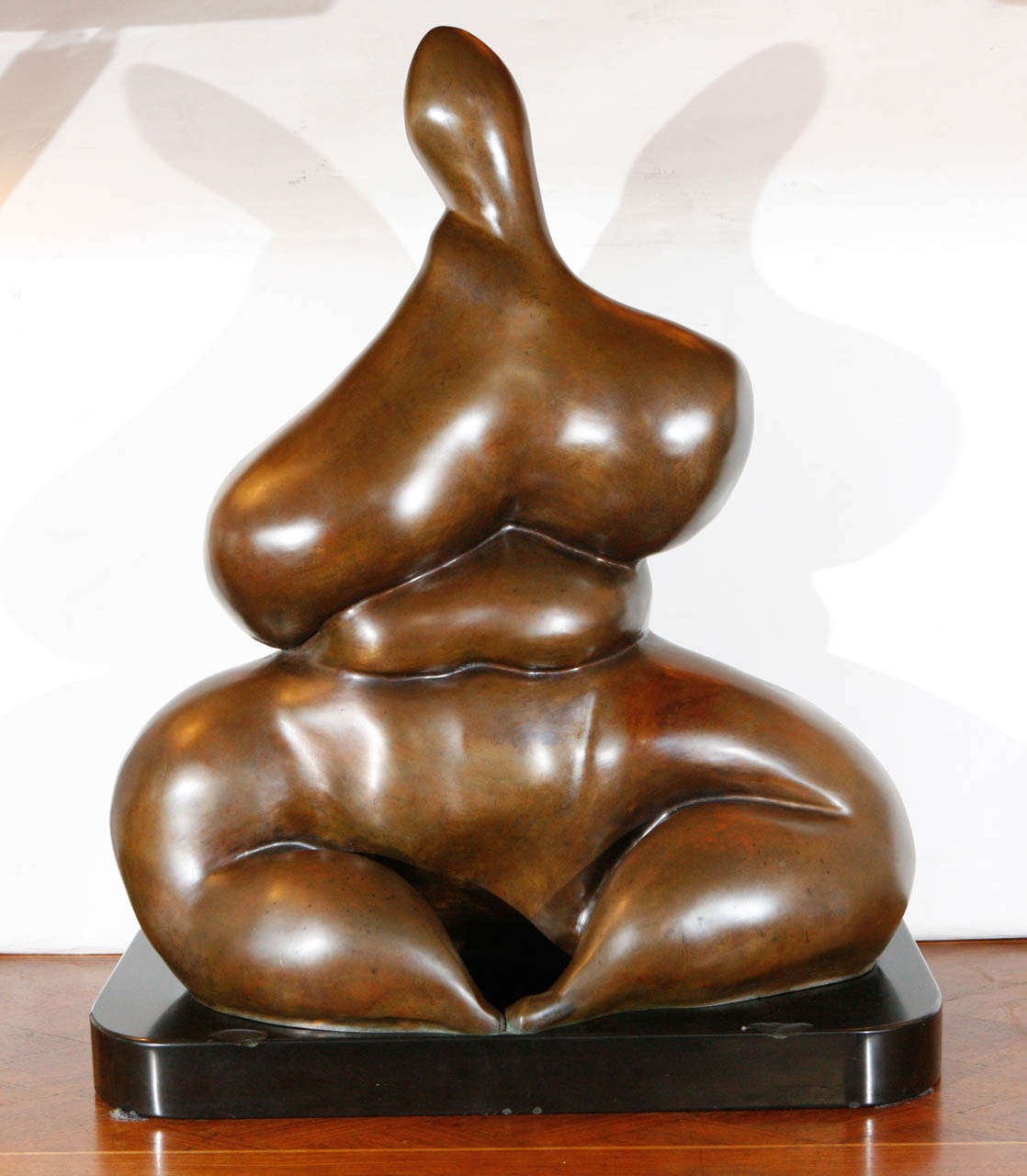 An amazing large bronze sculpture of a sitting woman by noted Southern California sculptor, Sy Rosenwasser. Signed and numbered 1/8. Sculpture is mounted on a black marble base. 

Sy Rosenwasser's work may be viewed in many public and private