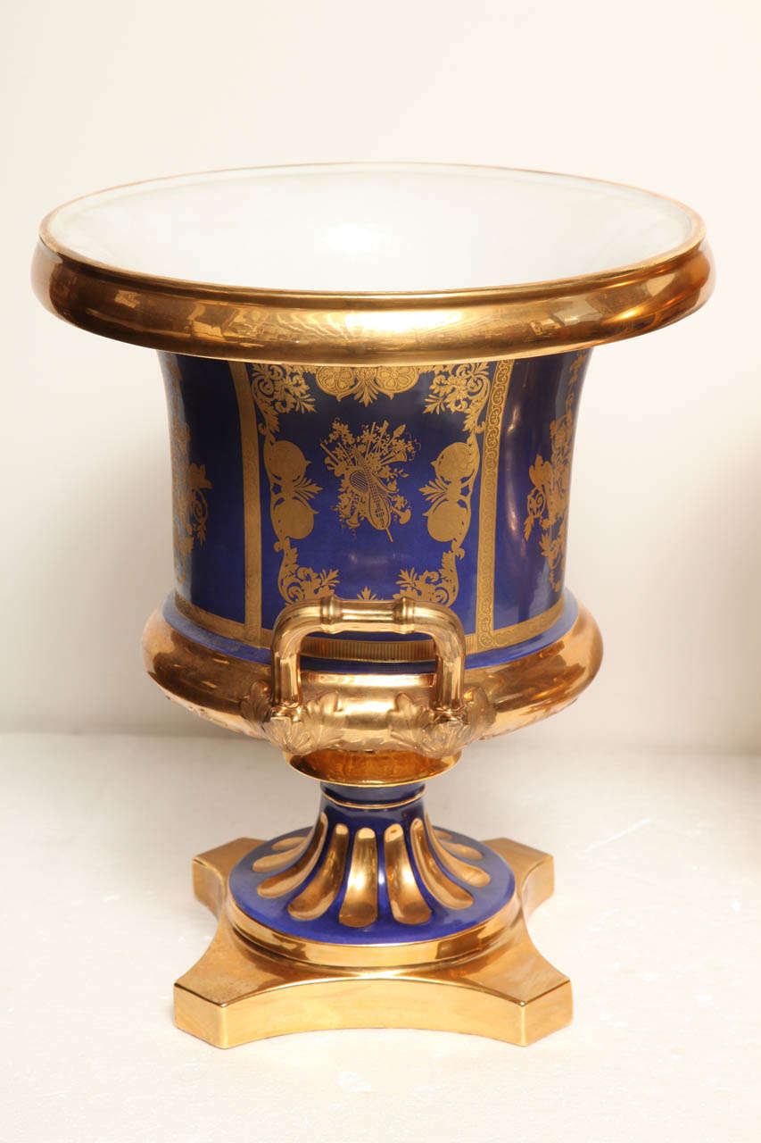 Pair of French, Blue Ground, Gilded Neo-Classical Urns 1