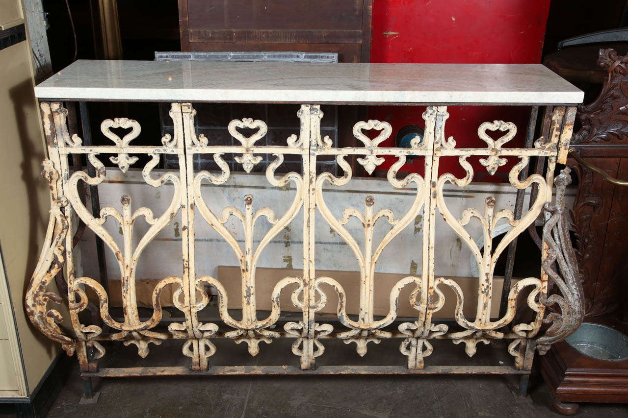 This console table was made from a salvaged cast iron Bombay style balcony from Buenos Aires, Argentina.  Original paint protected and sealed by spray lacquer. Once very common, these balconies are becoming very hard to find. This item can be seen