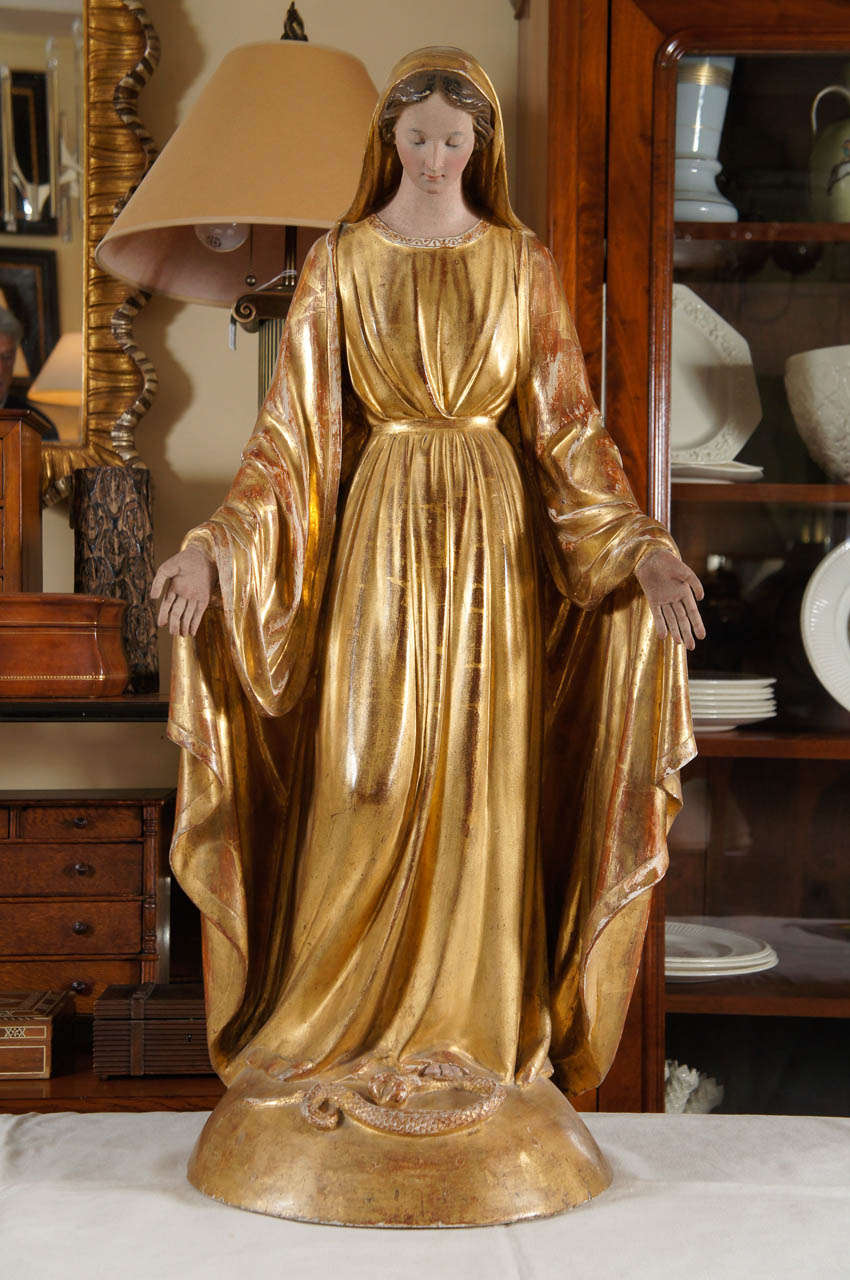 Carved gilt wood figure of a saint.