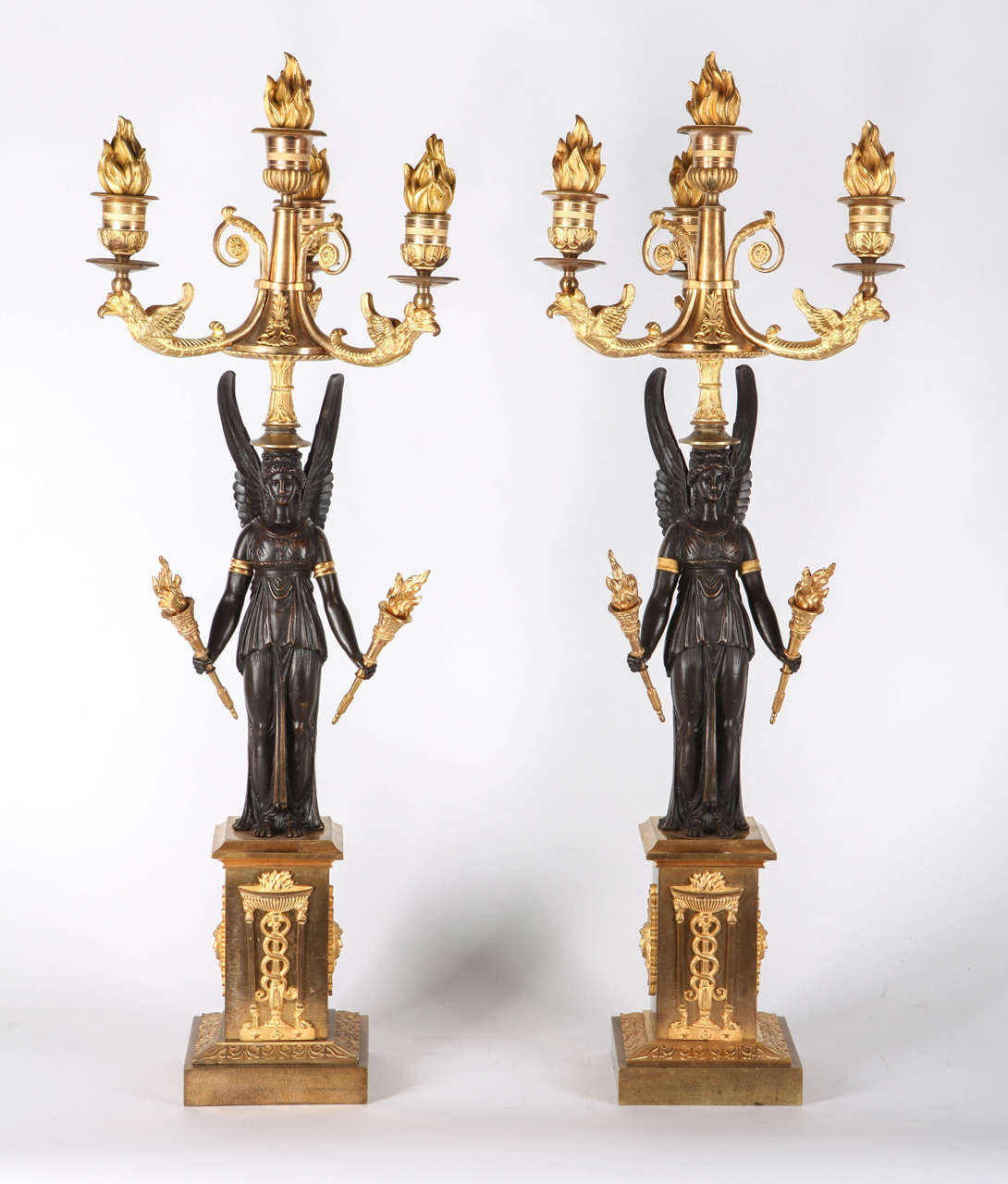 19th Century French Empire style Pair of gilt and patinated bronze candelabra