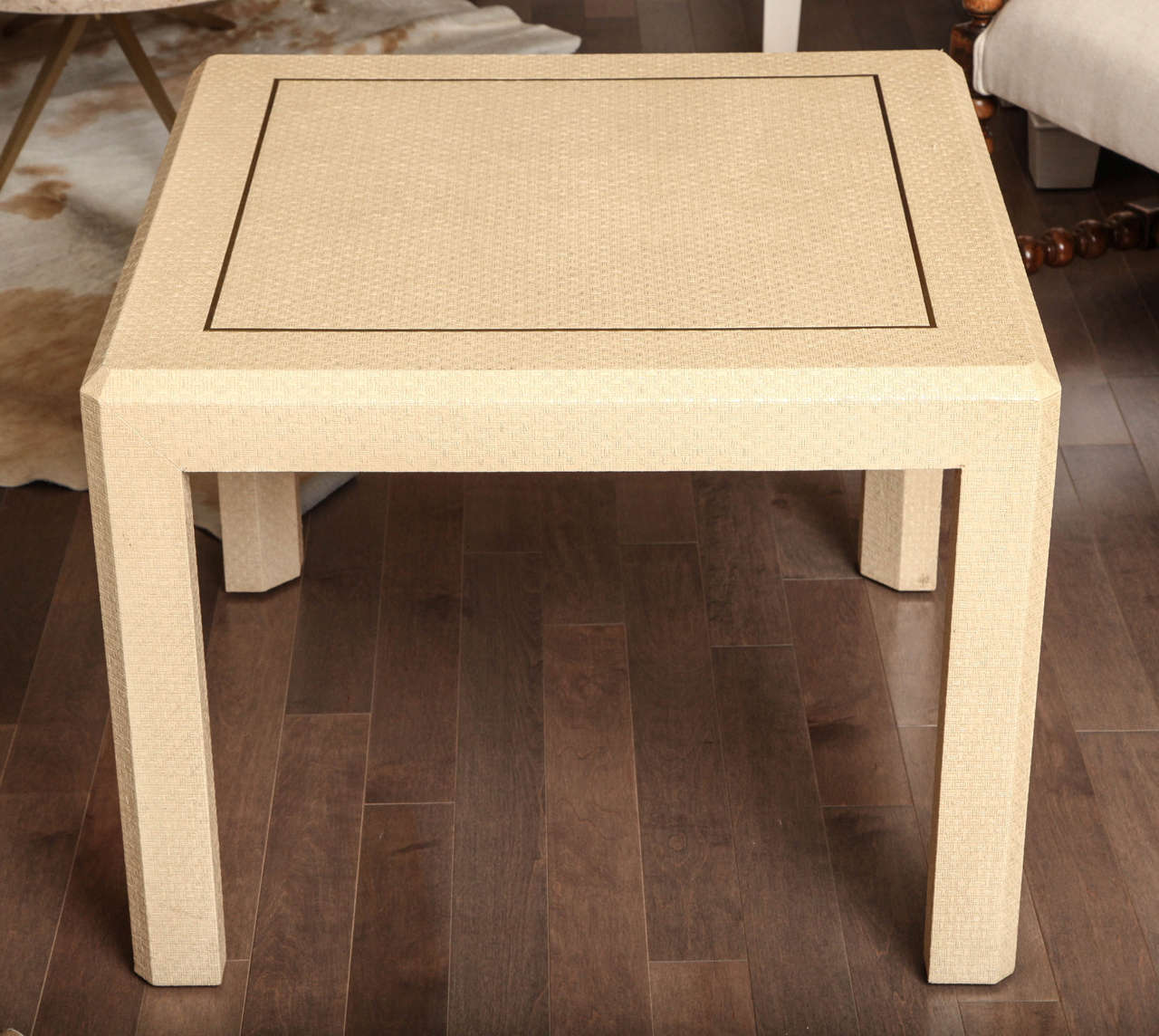 Pair of large raffia side tables with brass inlay attributed to Karl Springer, circa 1970.