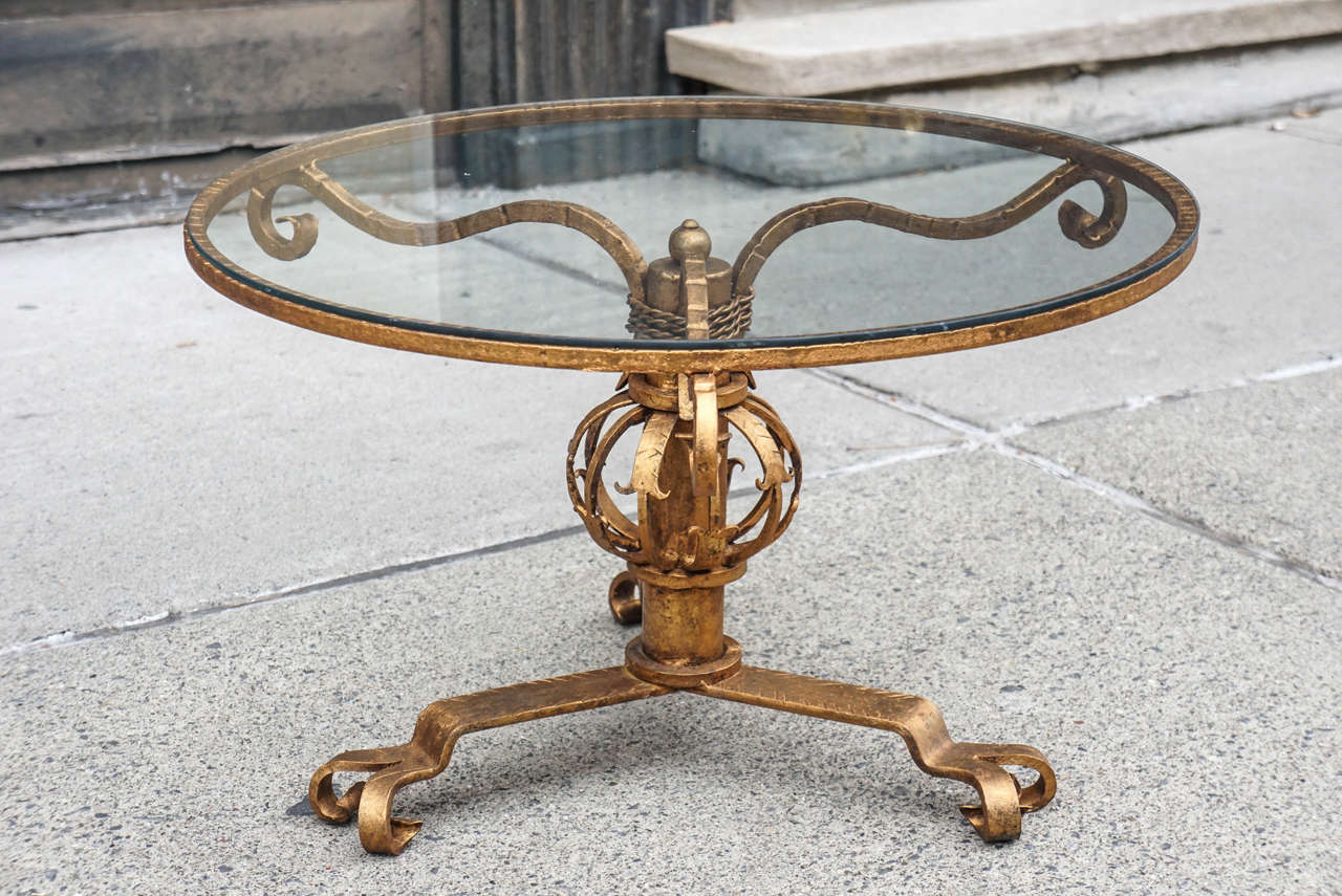 This Mid century hand wrought iron coffee table was made in Italy. Created to cater to the modern movements interest in clean simplicity but still retaining the time honored craft of hand work. The table is strong and decorative but reduced to clean