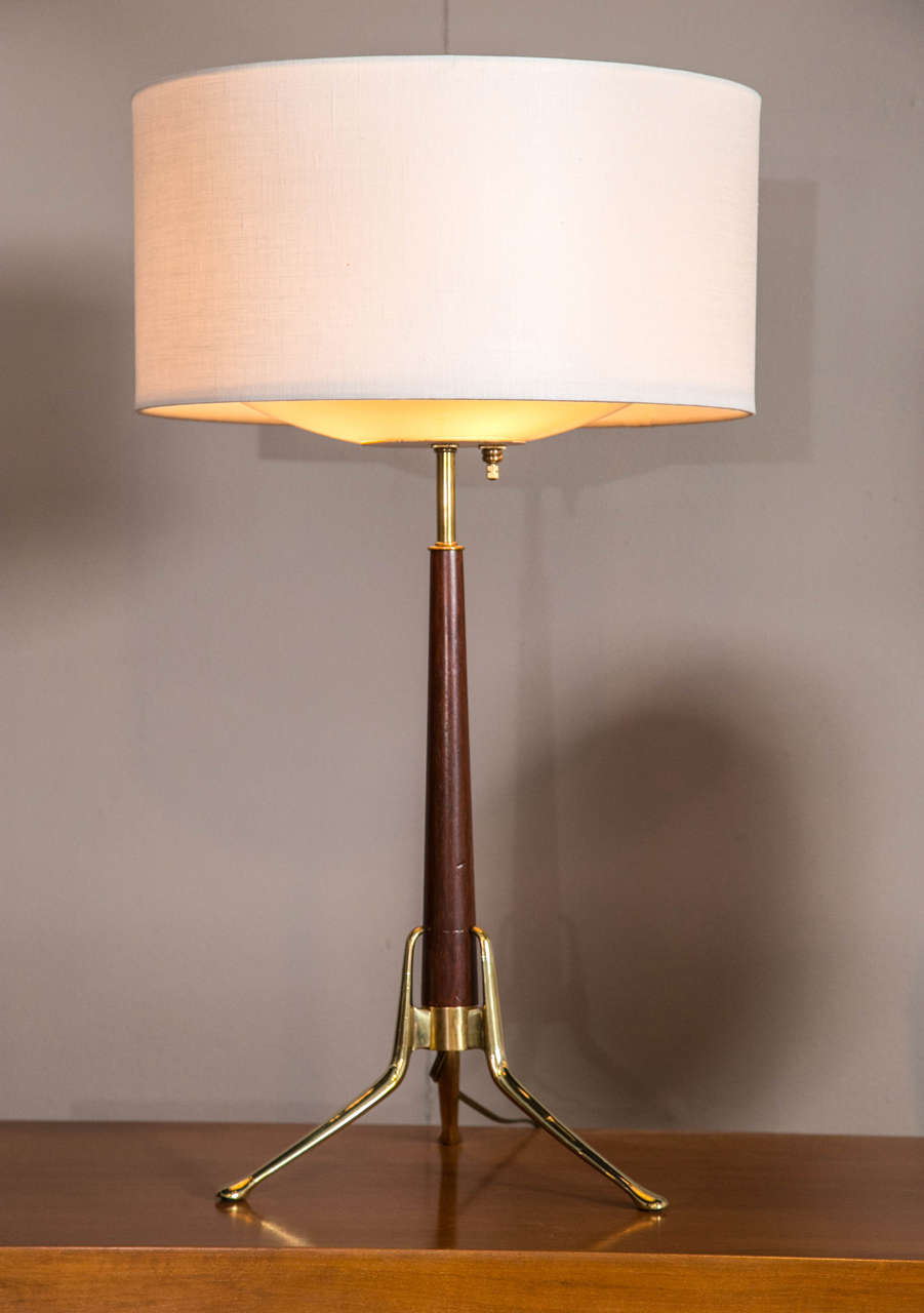 A pair of walnut and brass Gerald Thurston table lamps, circa 1950. Newly rewired and refinished.