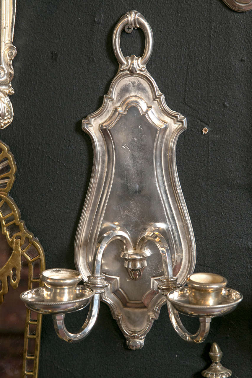 Pair of silver plated Caldwell sconces. Eight available priced per pair. Will be newly wired upon purchase.