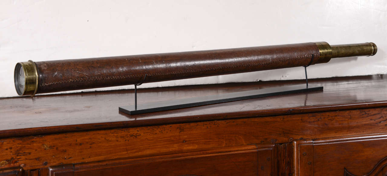 19th century leather clad telescope on custom Stand. Telescope still functions and extends to 49.5