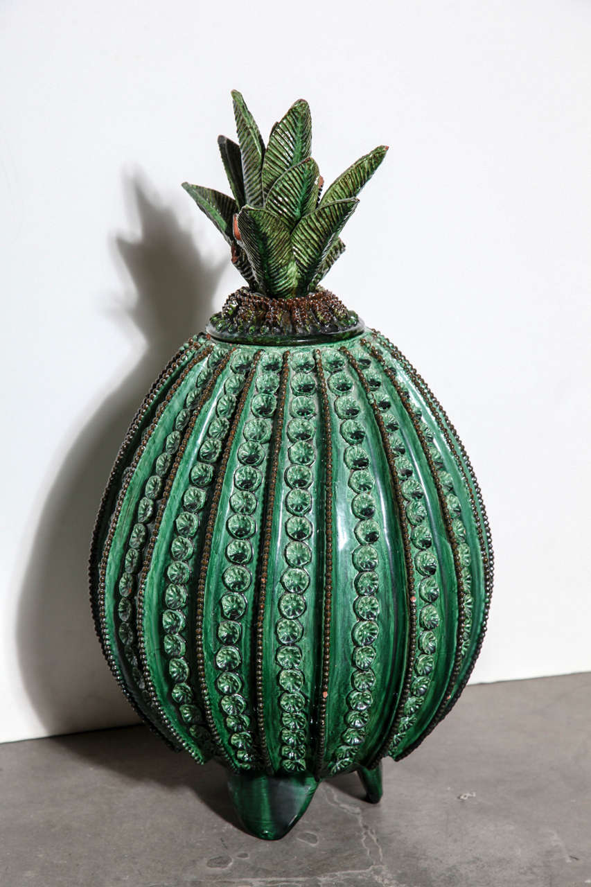 Green pottery pineapple handcrafted in Morelia, Mexico with removable top.