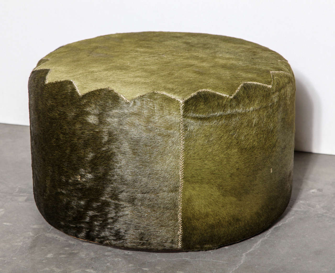 Unique green cowhide Casablanca pouf by Henry Beguelin. Hand-stitched detail.