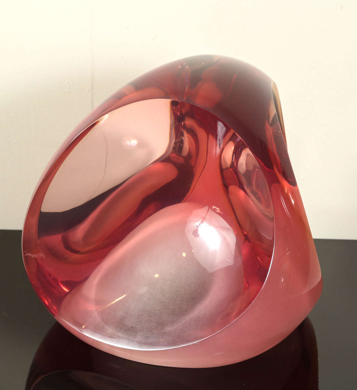 This giant poly-resin tabletop sculpture by Louis Von Koelnau. The artist is renown for his mastery of this notoriously difficult medium.
This piece is cast in a stunning and delicate rose color that diffuses the light beautifully.

It is number