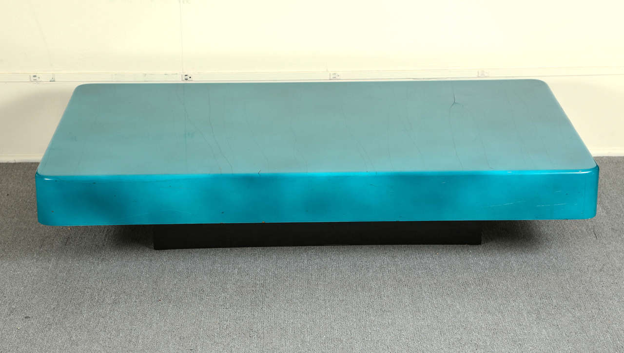 Peacock blue lacquered goat skin coffee table by Aldo Tura.
This table is Absolutely stunning. The  lacquered goat skin surface which has several crazing cracks, which in my eyes do not detract but enhance the  overall sophistication. 
The table