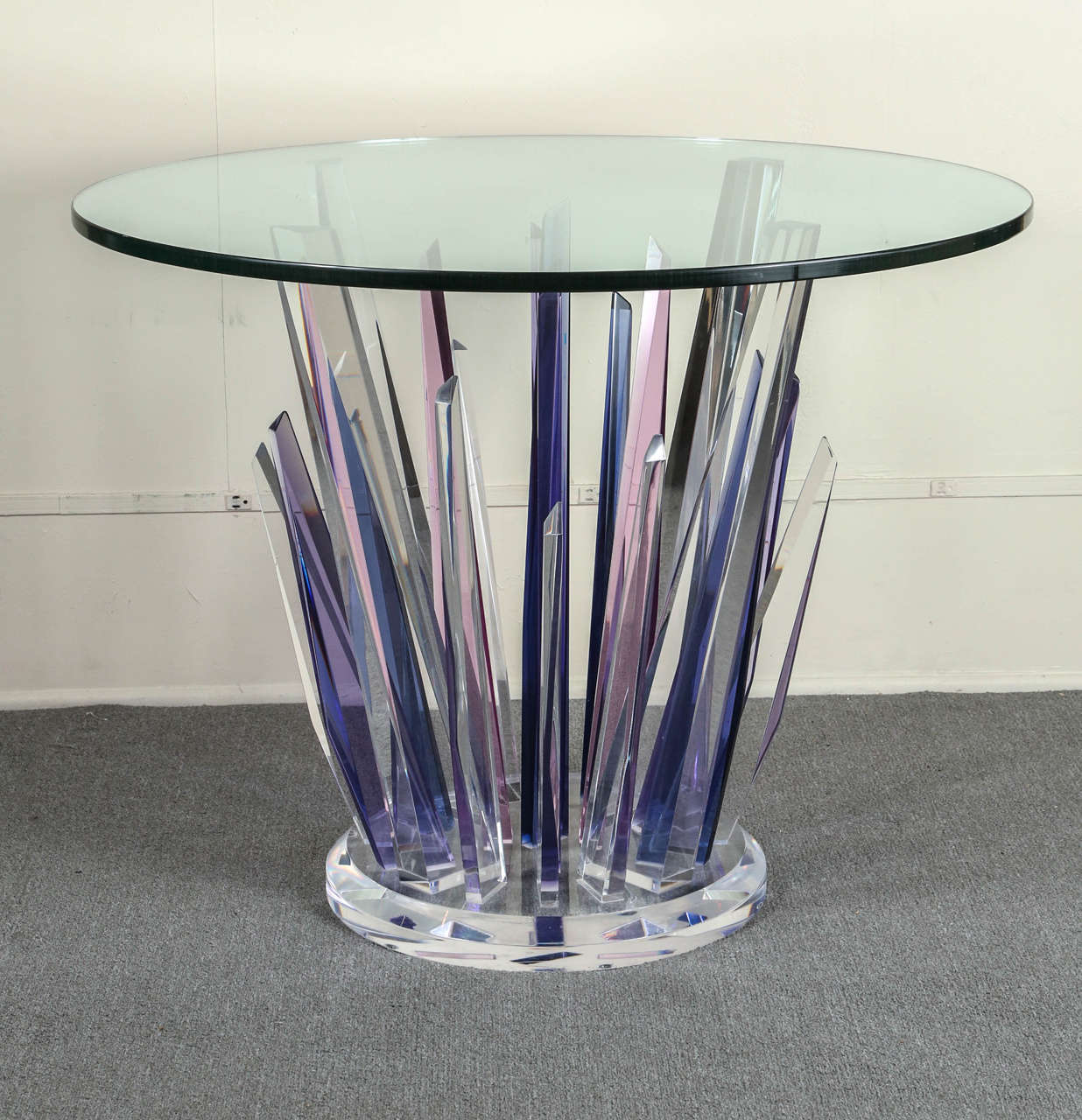 This stunning stalagmite lucite table is made up of clear,  magenta, pink 
and mauve pieces of lucite which rise from a clear 18