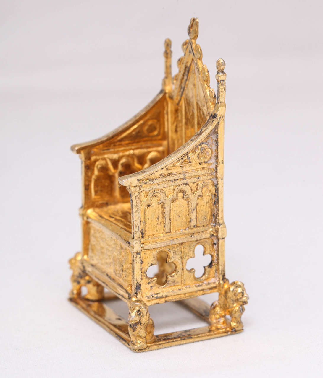 Edwardian, sterling silver-gilt, miniature coronation throne/chair, made for the coronation of King Edward VII. It is a replica of the one in Westminster Abbey. Made in Chester, England, 1901 by Cornelius Desormeu Saunders and James Francis Hollings
