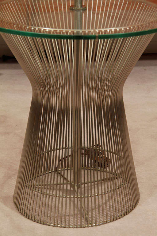 A pair of Warren Platner lamp side tables,by Knoll, nickel-plated wire bases,pole lamps, glass tops.