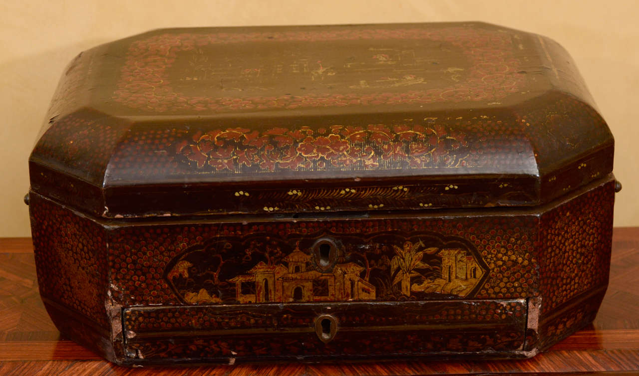 Chinese export lacquered box with gold decoration.