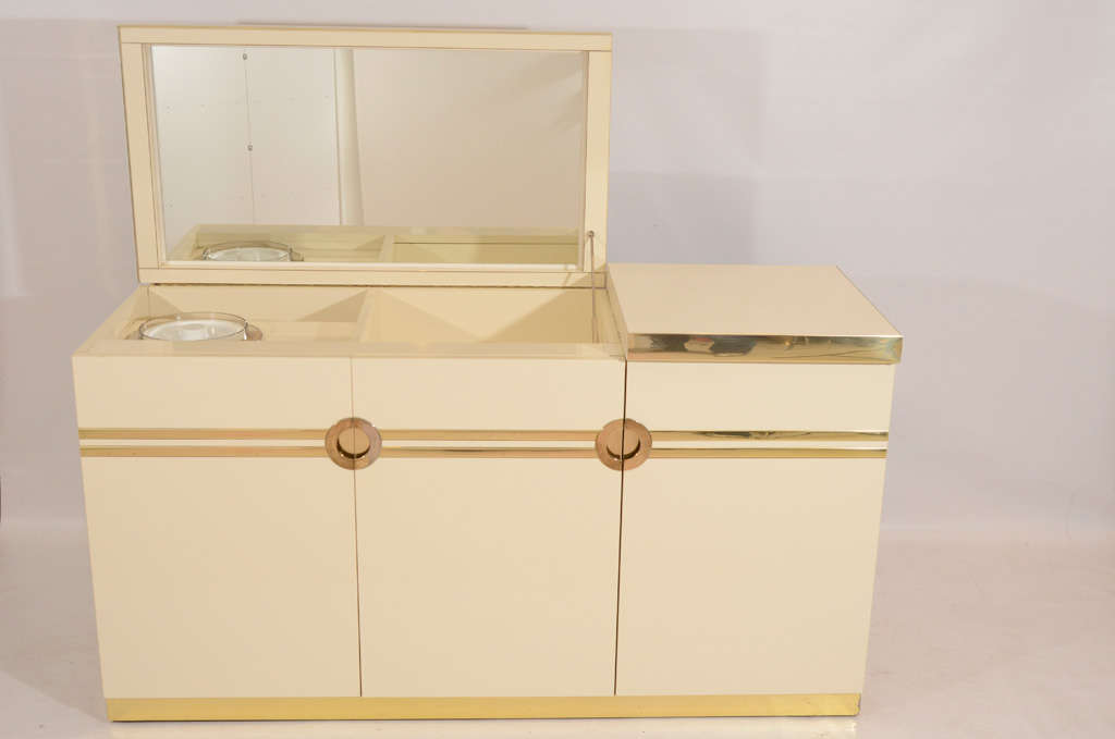Very stylish credenza designed and signed by Pierre Cardin. The top lifts up to reveal a mirror and bar interior with an ice bucket. Chic! Please contact for location.