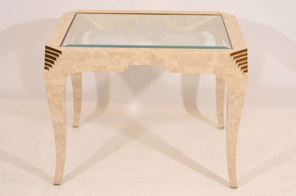 Very nicely detailed side or occasional table finished in a tessellated fossil stone with brass accents and a glass top by Merle Edelman for Casa Bique. Lovely! Please contact for location. 