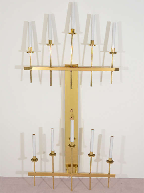Amazing pair of monumental Solid Polished brass candelabra-form sconces with ten lights each. The piece is similar to works produced by noted designer Tommi Parzinger.This High End 10 Light Sconces would Be perfect in any High End Modern Setting.
 