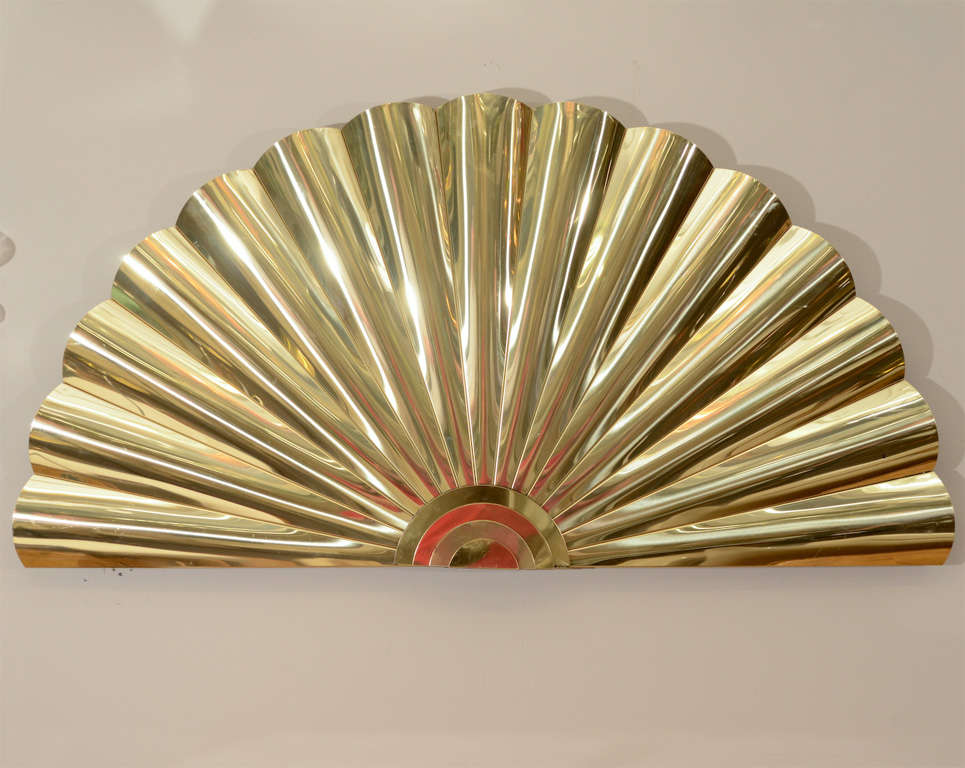 A large vintage brass wall-mounted sculpture of a fan. The piece is by Curtis Jere. The piece is in good vintage condition with age appropriate wear; some scratches.

Price reduced from $2800.00.