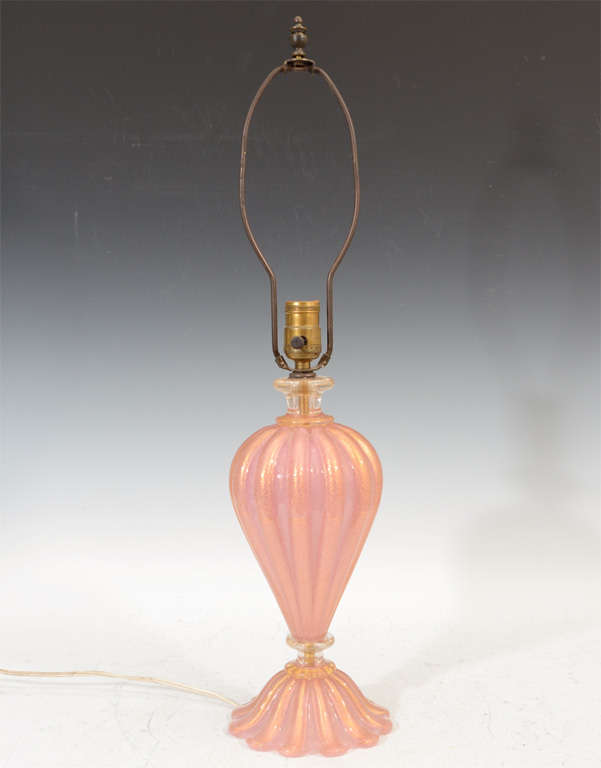 A pair of vintage Italian Murano glass table lamps in pink with gold flecked luster.