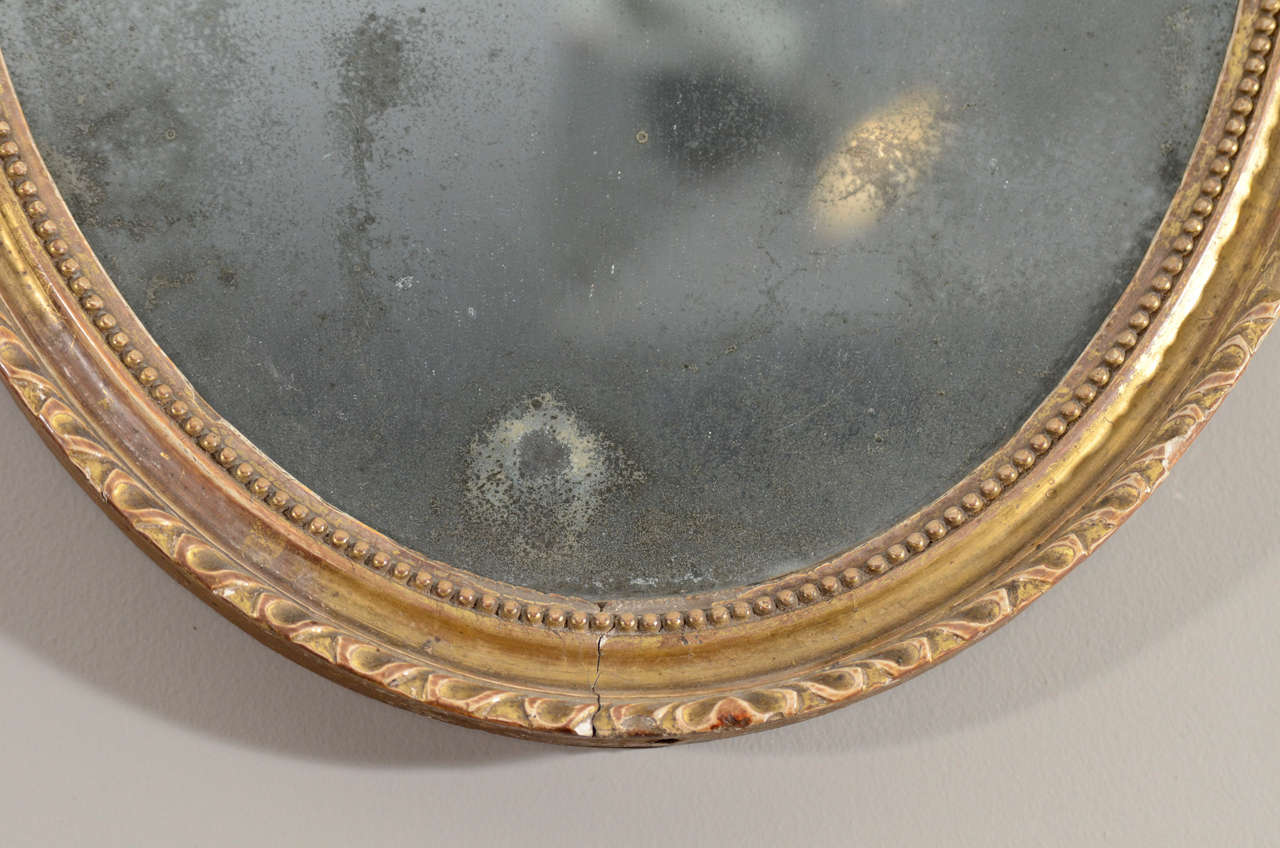 Georgian Pair of 18th Century English Oval Gilt Mirrors For Sale