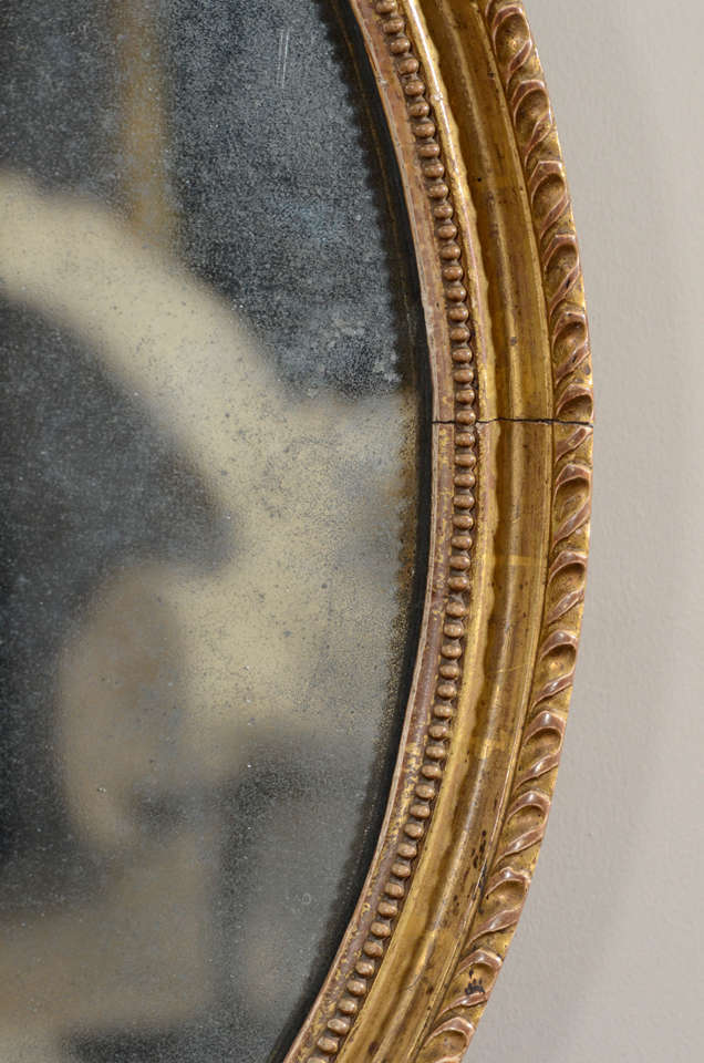 18th Century and Earlier Pair of 18th Century English Oval Gilt Mirrors For Sale