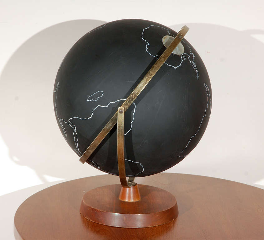 Matte black globe is unlike any other we’ve come across in our travels. Wood base with patinaed brass details and all continents and countries have been rendered by hand. A work of art!